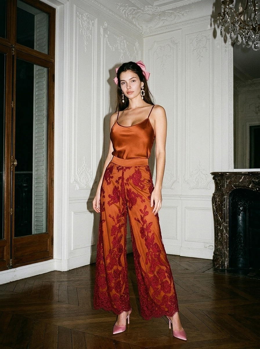 Model wearing Rosamosario orange lingerie set